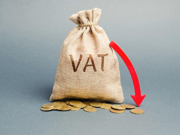 a brown sack with the word 'VAT' written on it, coins scattered across the floor. Next to the bag is a red arrow pointing downwards.