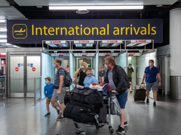 'INTERNATIONAL ARRIVALS' sign in a UK airport