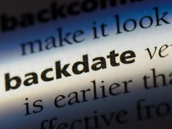 A highlighted word in a dictionary. The word highlighted is 'BACKDATE'.