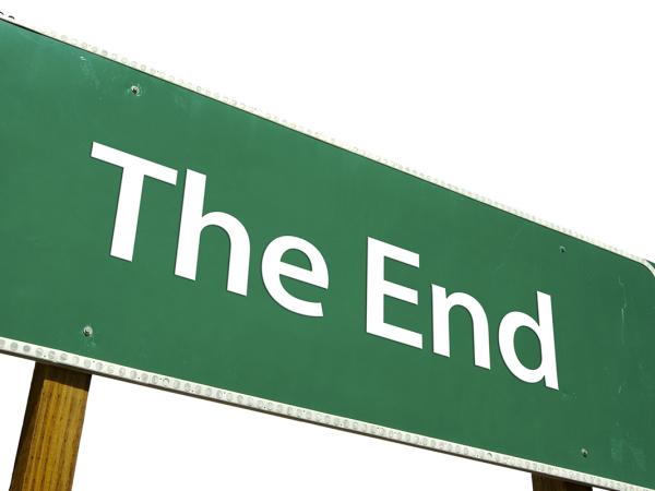 A green coloured street sign with the words 'THE END' in white text. 