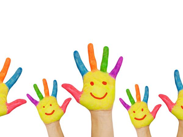 5 hands raised, on each hand a smiley face is painted on the palm with the fingers each painted a different colour. 