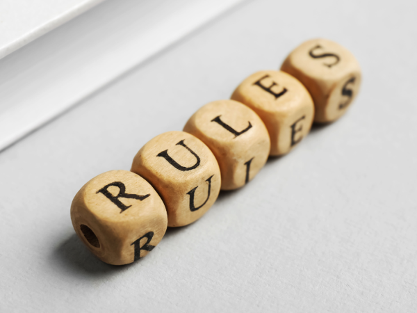 wooden blocks that spell out the word 'RULES'. 