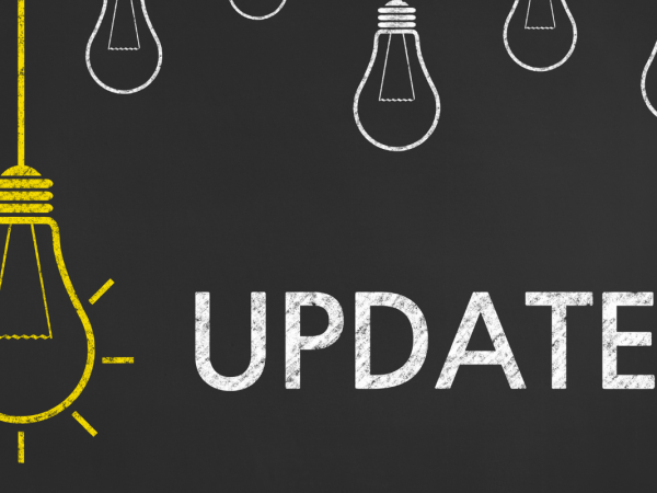 Black background with a yellow hanging lightbulb illustration next to the word 'UPDATE'