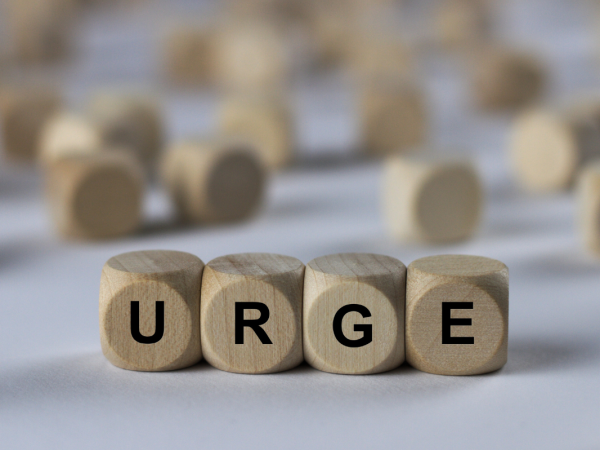 wooden letter blocks that spell out the word 'URGE' 