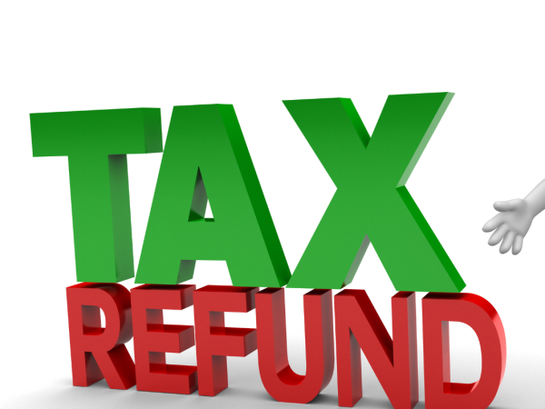 A person wearing a hat, a tie and carrying a briefcase next to the words 'TAX REFUND' 