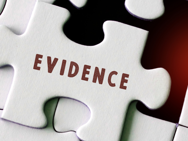 a white jigsaw missing one piece, the missing piece has the word 'EVIDENCE' on it.