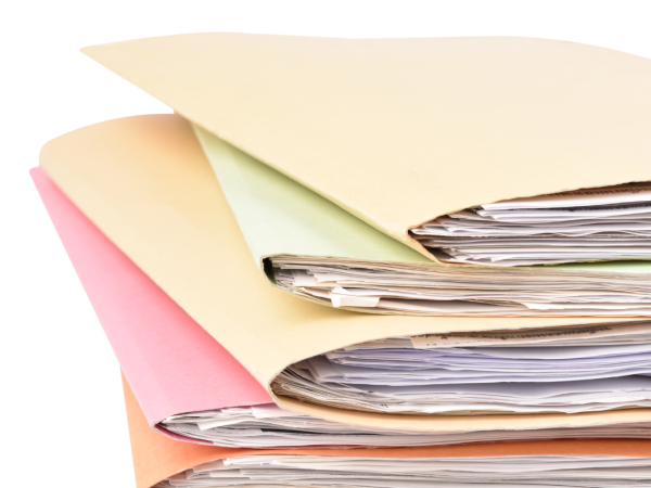 A stack of folders each containing documents