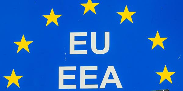 a blue background with 7 yellow stars in an arch pattern, underneath this are the words 'EU' and 'EEA' in white text