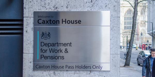 sign for the DWP building in the UK, the sign reads 'WELCOME TO CAXTON HOUSE DEPARTMENT FOR WORK & PENSIONS' 