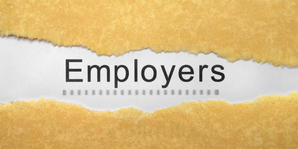 Brown paper with a tear on the front, where the paper is torn white paper can be seen beneath with the word 'EMPLOYERS' typed in black text.