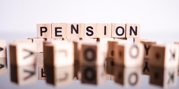 Wooden blocks that spell out the word 'PENSION'.