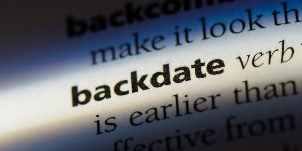 A highlighted word in a dictionary. The word highlighted is 'BACKDATE'.