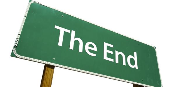 A green coloured street sign with the words 'THE END' in white text. 
