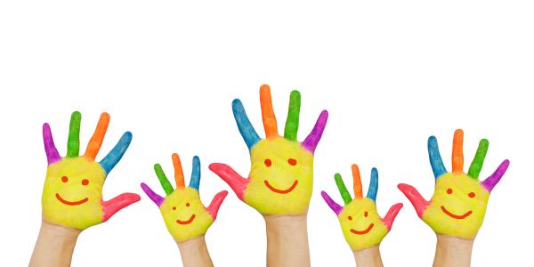 5 hands raised, on each hand a smiley face is painted on the palm with the fingers each painted a different colour. 