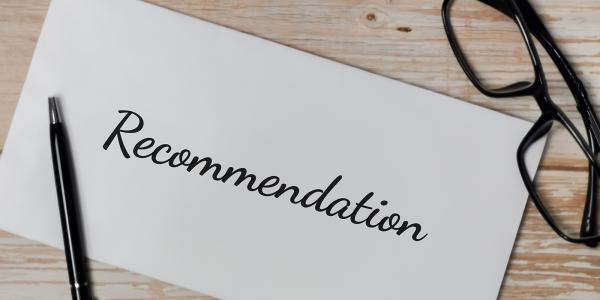 The word 'RECOMMENDATION' written with black ink on white paper. 