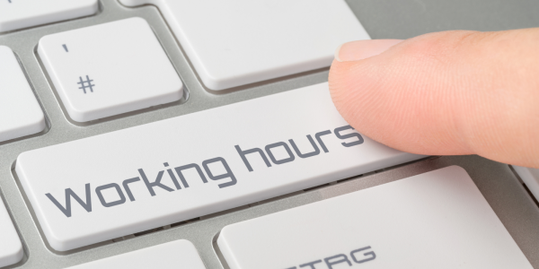 a keyboard with a key saying 'WORKING HOURS' 