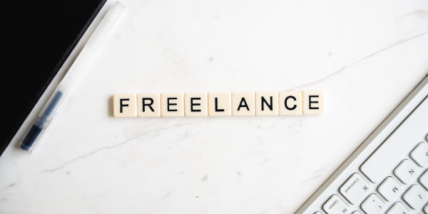 letter tiles arranged to spell out the word 'FREELANCE'. 
