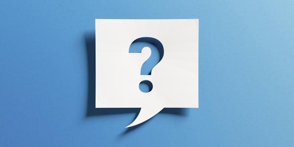 A white speech bubble box with a '?' inside against a blue background.