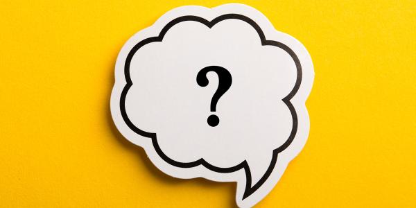 A yellow background with a white speech bubble containing a question mark. 
