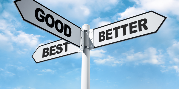 a white street sign with 3 words written on them 'GOOD', 'BETTER', 'BEST'.