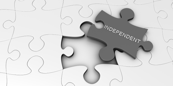 a white jigsaw missing one piece, the missing piece has the word 'INDEPENDENT' on it.