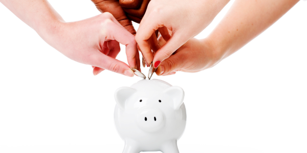 white piggy bank with people putting coins inside