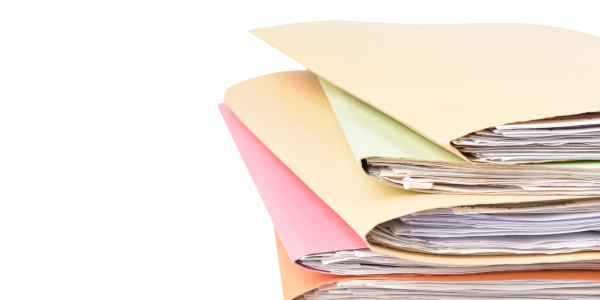 A stack of folders each containing documents